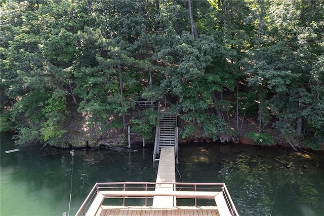 view of dock with a water view and stairway