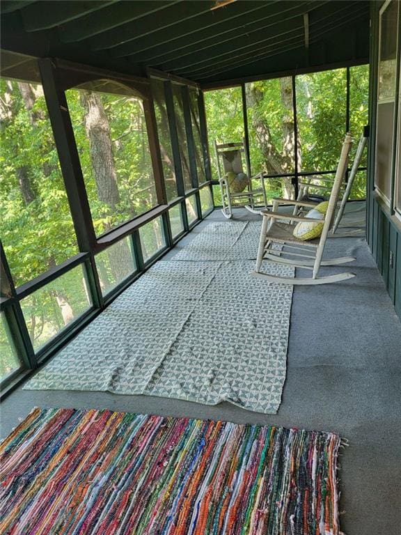 unfurnished sunroom with plenty of natural light