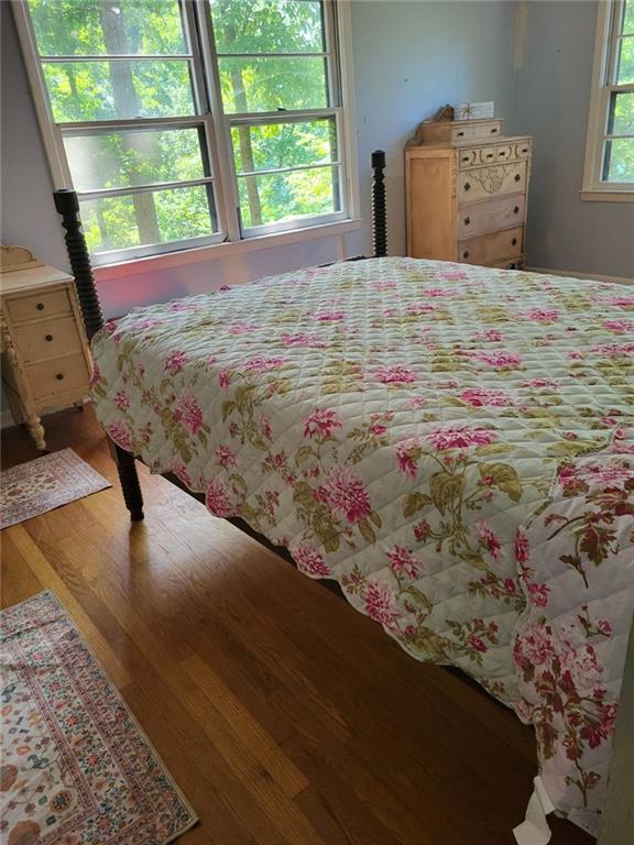 bedroom with wood finished floors