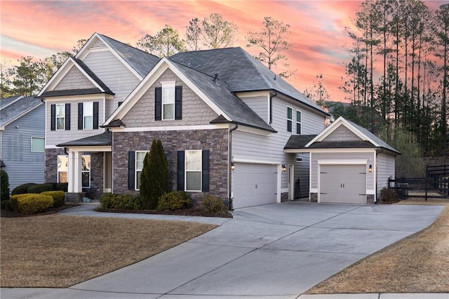 craftsman inspired home with stone siding and concrete driveway