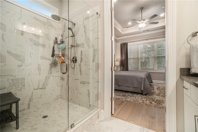 bathroom featuring crown molding, baseboards, ceiling fan, connected bathroom, and a shower stall