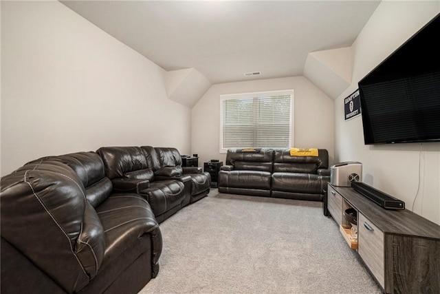 living area featuring visible vents, light carpet, and vaulted ceiling