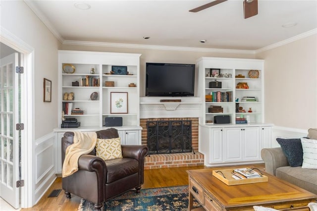 3157 Sawyer Ct NE, Marietta, GA 30066 - living room featuring wood finished floors, ceiling fan, crown molding, and visible vents
