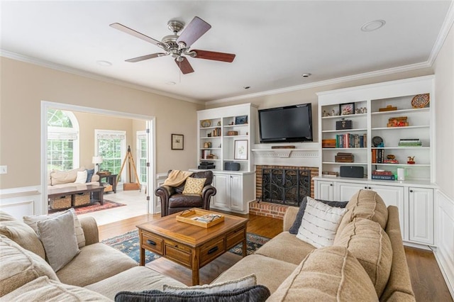 3157 Sawyer Ct NE, Marietta, GA 30066 - living room with a fireplace, wood finished floors, a ceiling fan, and ornamental molding