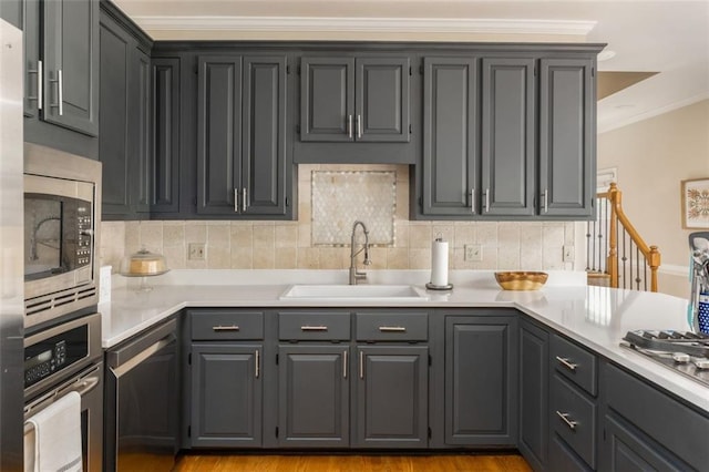 3157 Sawyer Ct NE, Marietta, GA 30066 - kitchen with a sink, stainless steel appliances, backsplash, light countertops, and ornamental molding