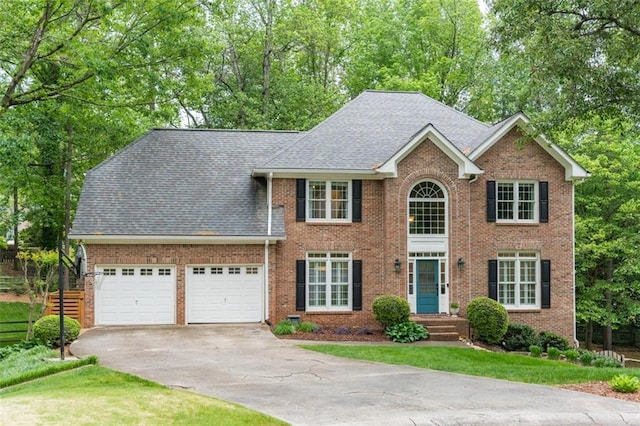 3157 Sawyer Ct NE, Marietta, GA 30066 - colonial home with concrete driveway, roof with shingles, brick siding, a front lawn, and a garage
