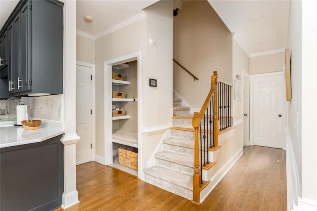 3157 Sawyer Ct NE, Marietta, GA 30066 - interior space featuring light countertops, crown molding, and light wood-style flooring