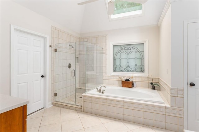3157 Sawyer Ct NE, Marietta, GA 30066 - full bathroom with a shower stall, a bath, tile patterned floors, lofted ceiling with skylight, and a ceiling fan