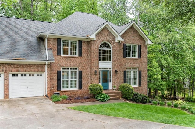 3157 Sawyer Ct NE, Marietta, GA 30066 - colonial inspired home with concrete driveway, a shingled roof, a front lawn, and brick siding