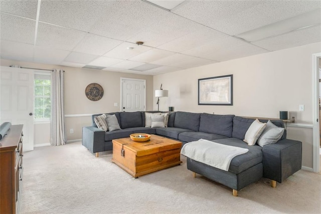 3157 Sawyer Ct NE, Marietta, GA 30066 - living room featuring light colored carpet, a drop ceiling, and baseboards