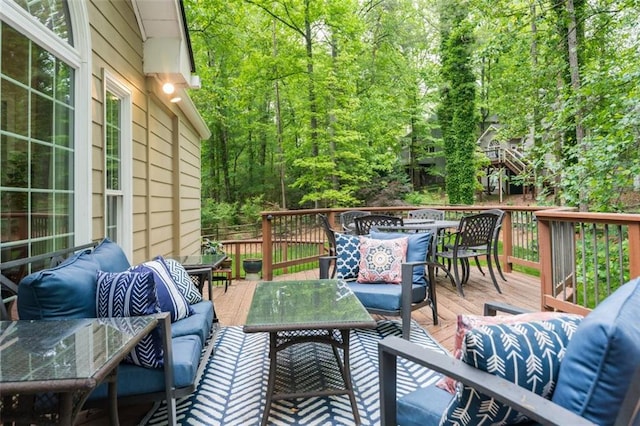 3157 Sawyer Ct NE, Marietta, GA 30066 - wooden deck featuring outdoor dining space, outdoor lounge area, and a forest view