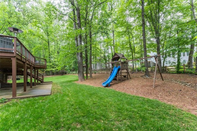 3157 Sawyer Ct NE, Marietta, GA 30066 - communal playground featuring a deck, a yard, stairway, fence, and a patio