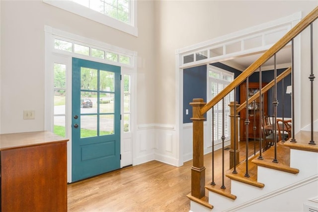 3157 Sawyer Ct NE, Marietta, GA 30066 - entrance foyer with a high ceiling, a wainscoted wall, stairs, and wood finished floors