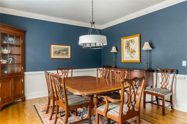 3157 Sawyer Ct NE, Marietta, GA 30066 - dining room with wood finished floors, a wainscoted wall, and ornamental molding