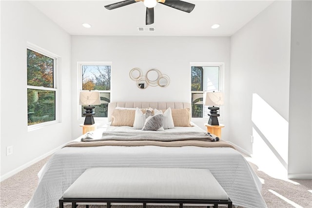 bedroom with ceiling fan and carpet floors