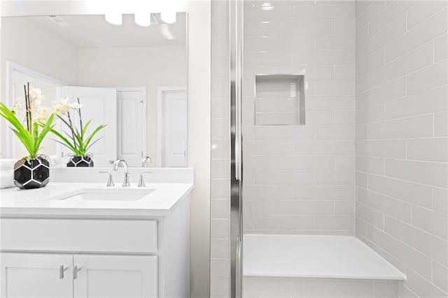 bathroom with vanity and walk in shower