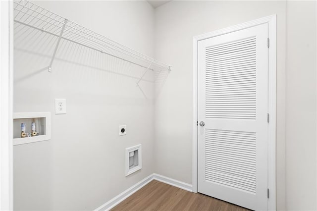 laundry room featuring electric dryer hookup, hookup for a washing machine, and wood-type flooring