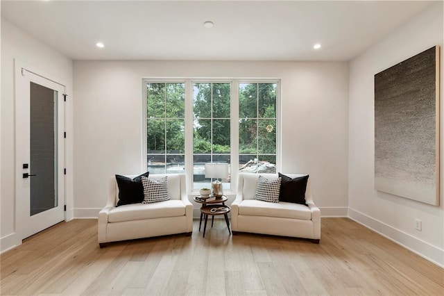 sitting room featuring light hardwood / wood-style flooring