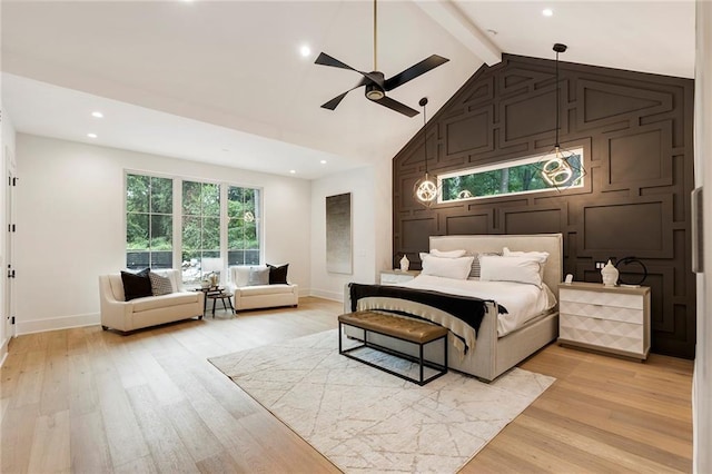 bedroom with ceiling fan, light hardwood / wood-style floors, and lofted ceiling with beams