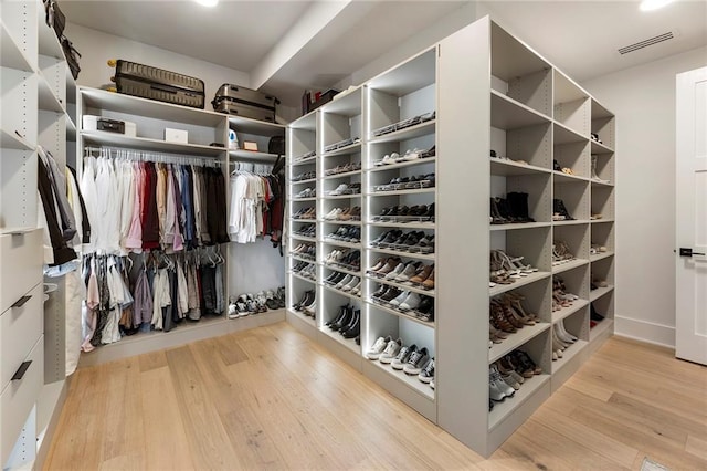 walk in closet featuring light wood-type flooring