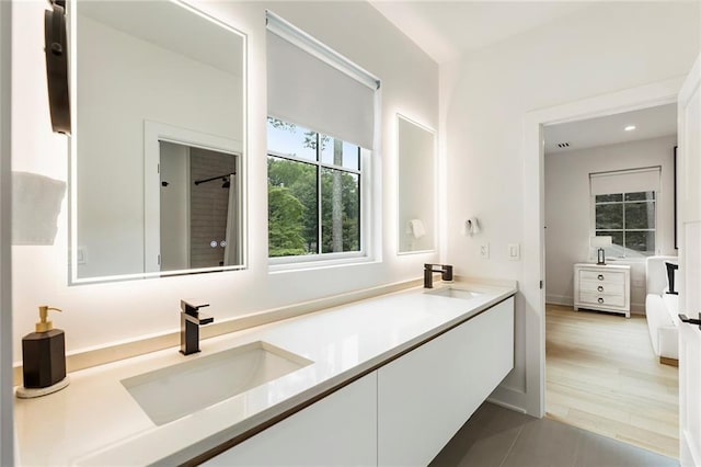 bathroom featuring tile patterned flooring and vanity