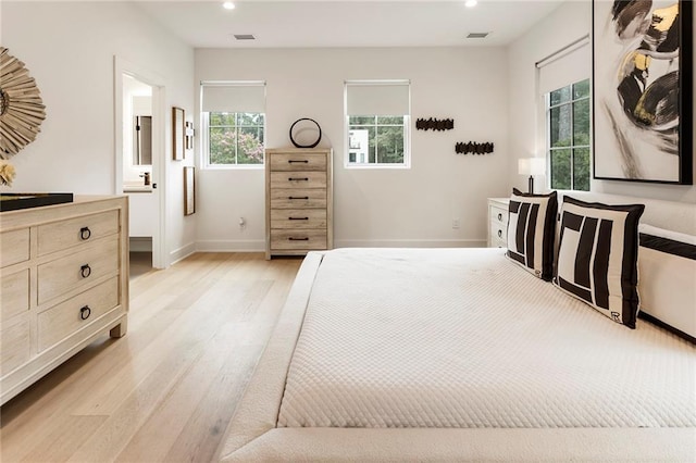 bedroom featuring light wood-type flooring