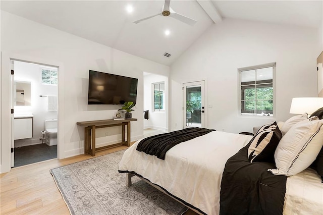 bedroom featuring access to exterior, ceiling fan, ensuite bathroom, light hardwood / wood-style flooring, and beam ceiling