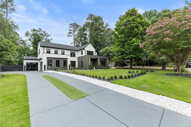 modern home with a front yard and a garage