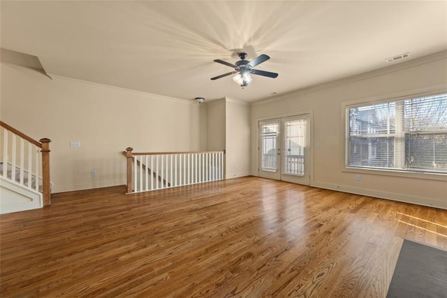 unfurnished room featuring ceiling fan, hardwood / wood-style floors, french doors, and ornamental molding