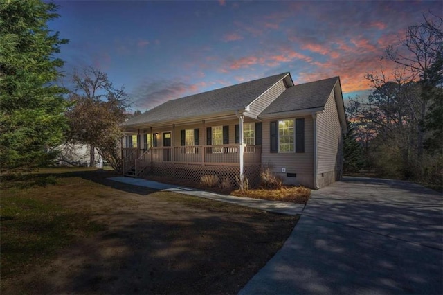 view of home's exterior with crawl space and covered porch