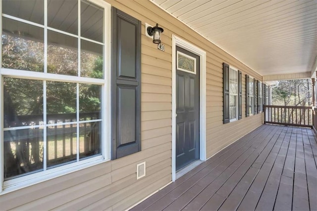 wooden terrace featuring a porch