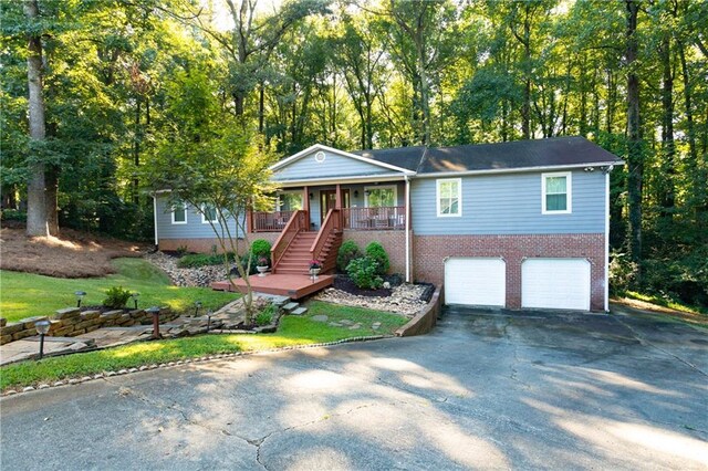 view of front facade with a garage and covered porch