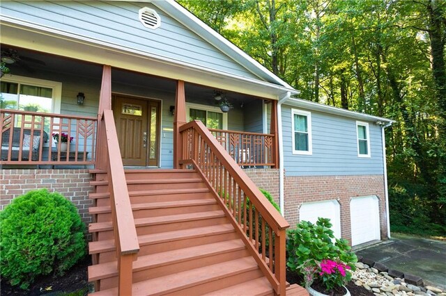 entrance to property with a porch and a garage