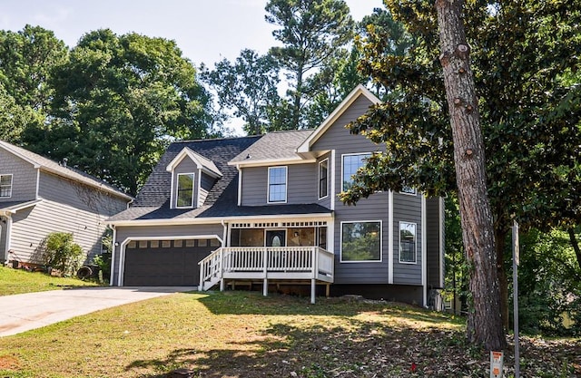 view of front of home with a front lawn, a porch, and a garage