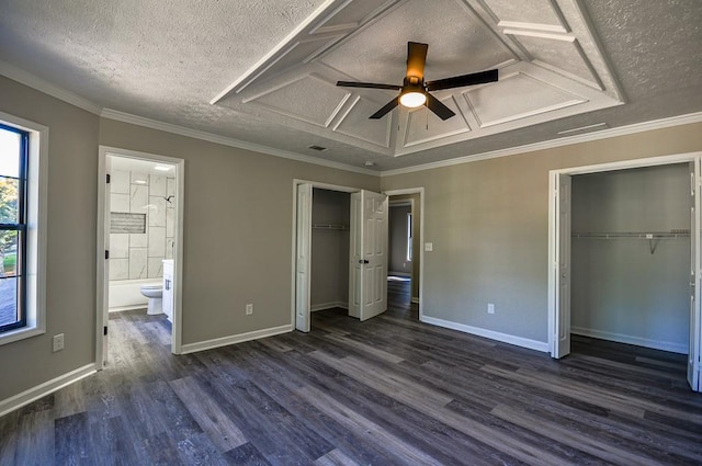 unfurnished bedroom featuring ceiling fan, ensuite bath, dark hardwood / wood-style floors, and ornamental molding