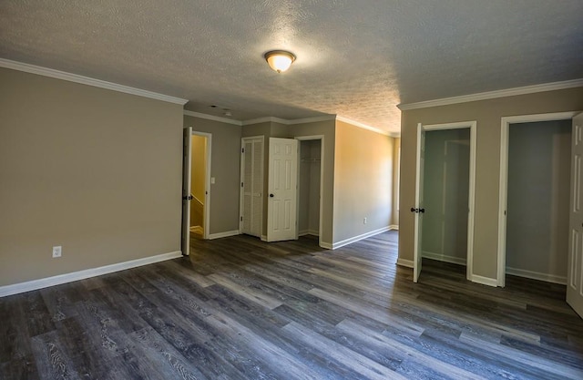 interior space with dark hardwood / wood-style floors and crown molding