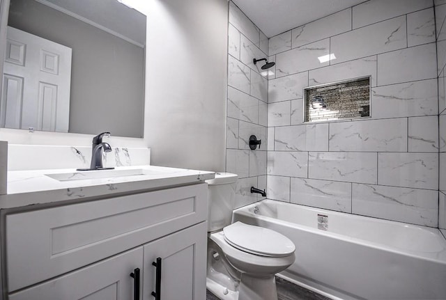 full bathroom with tiled shower / bath, hardwood / wood-style flooring, vanity, and toilet