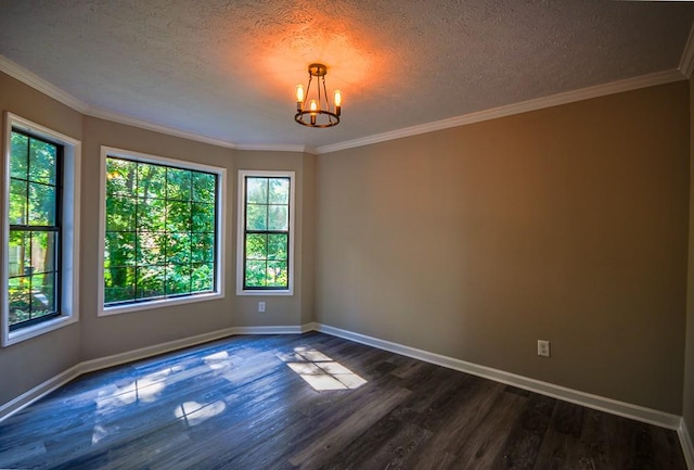 spare room with a textured ceiling, crown molding, an inviting chandelier, and dark hardwood / wood-style flooring