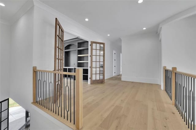 3893 Indian Shoals Rd, Dacula, GA 30019 - hallway featuring wood finished floors, recessed lighting, an upstairs landing, and crown molding