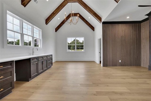 3893 Indian Shoals Rd, Dacula, GA 30019 - interior space with beam ceiling, light wood finished floors, a chandelier, high vaulted ceiling, and recessed lighting