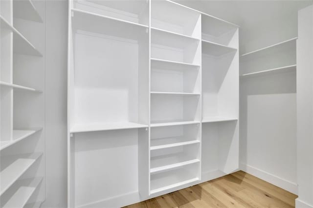 3893 Indian Shoals Rd, Dacula, GA 30019 - walk in closet featuring wood finished floors