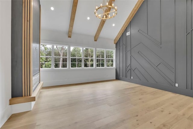 3893 Indian Shoals Rd, Dacula, GA 30019 - unfurnished living room featuring a chandelier, beam ceiling, light wood-type flooring, recessed lighting, and high vaulted ceiling