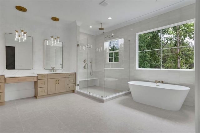 3893 Indian Shoals Rd, Dacula, GA 30019 - bathroom with a shower stall, vanity, a soaking tub, a chandelier, and recessed lighting