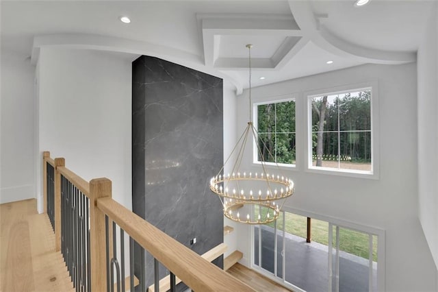 3893 Indian Shoals Rd, Dacula, GA 30019 - hall with an upstairs landing, recessed lighting, wood finished floors, a chandelier, and coffered ceiling
