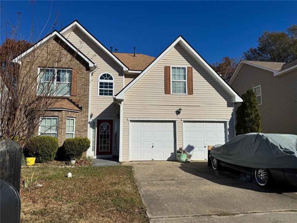 11631 Kades Trl, Hampton, GA 30228 - traditional home featuring driveway and an attached garage