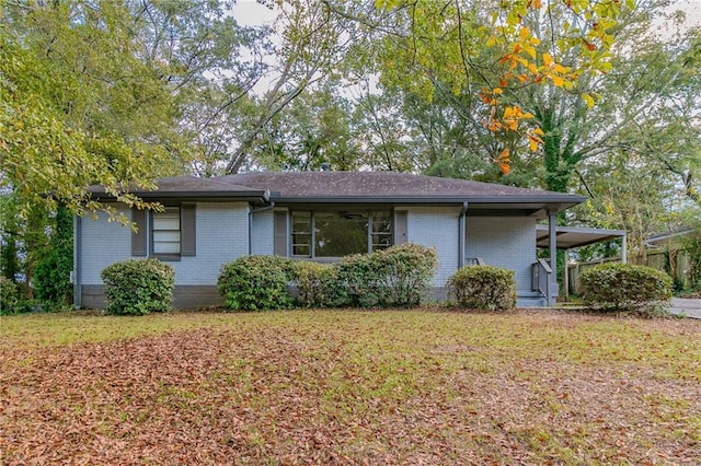 view of side of property with a lawn