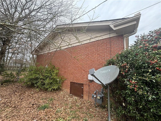 view of home's exterior with brick siding