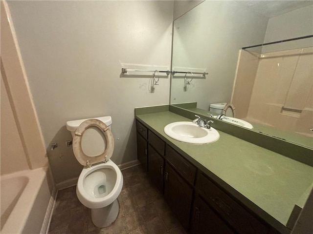 full bath with baseboards, vanity, toilet, and tub / shower combination