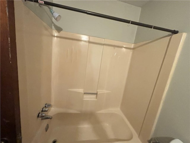 bathroom featuring washtub / shower combination