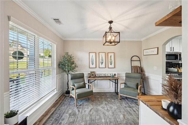 45 Peregrine Ln S, Dawsonville, GA 30534 - sitting room with arched walkways, visible vents, a notable chandelier, wood finished floors, and ornamental molding